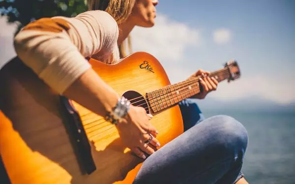11 Woman playing guitar