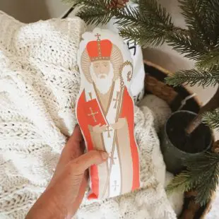 St. Nicholas Decorative Pillow St. Nicholas Decorative Pillow - This beautiful handmade pillow is a great way to celebrate St. Nicholas in your home on his feast day or all year long! Each pillow features an original illustration of St. Nicholas and is lovingly sewn and packaged in our studio in Manhattan, Kansas. Here is a link to the item: https://etsy.me/3jFkZVK
- Coupon: Receive 15% off orders of $35+ now through Dec 6th using code CL2020.
- https://www.gratiadesignco.com 
- Gratia Design Co is a creative studio that seeks to celebrate the beauty of God's grace and inspire joy through art and design. Bringing you quality made cards, stickers, prints, and home decor inspired by our Catholic faith and the lives of the saints.