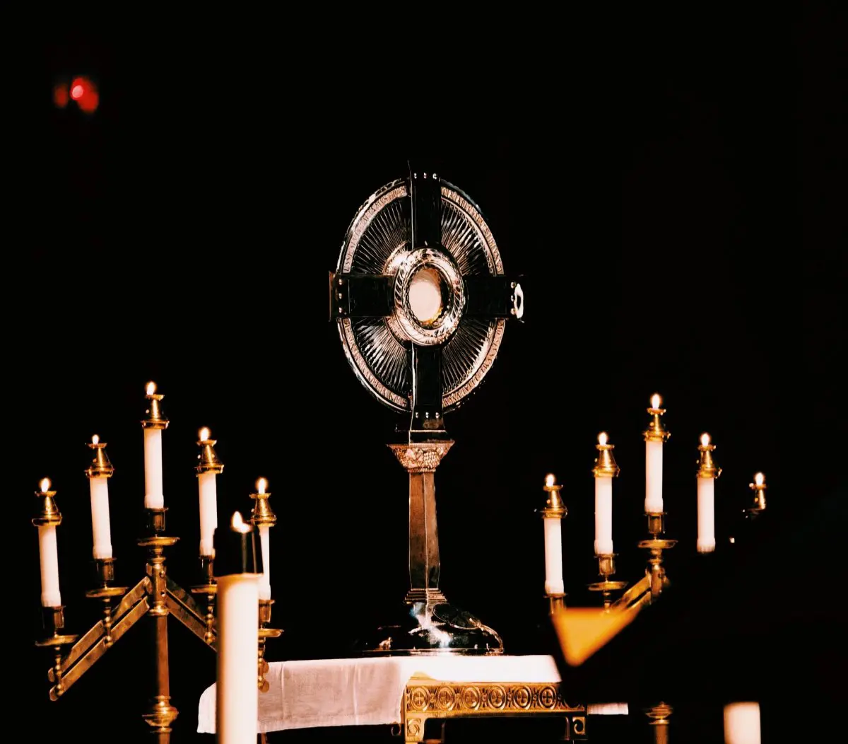 Catholic belief Eucharist real presence Jesus