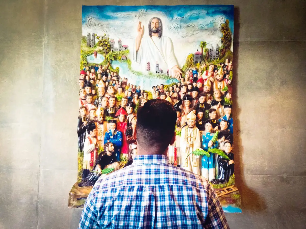 why do catholics pray to saints and angels
